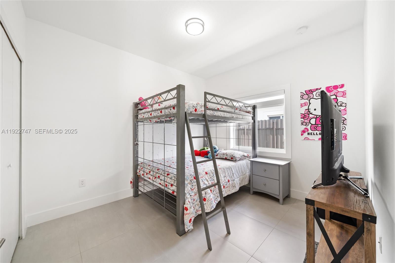 17341 Southwest 304th Street Homestead, FL 33030 - Photo 19 of 25 a bedroom with bed and a window