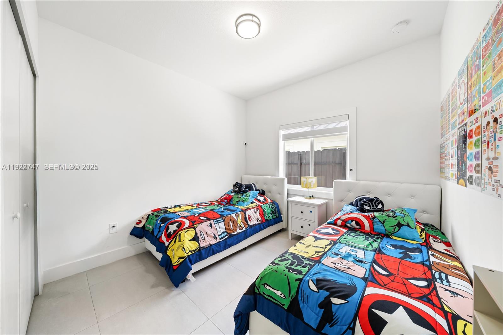 17341 Southwest 304th Street Homestead, FL 33030 - Photo 20 of 25 a bedroom with two beds and a couch