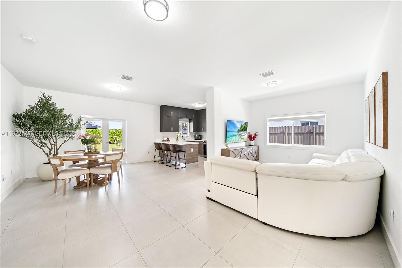 17341 Southwest 304th Street Homestead, FL 33030 - Photo 6 of 25 a living room with furniture and a large window