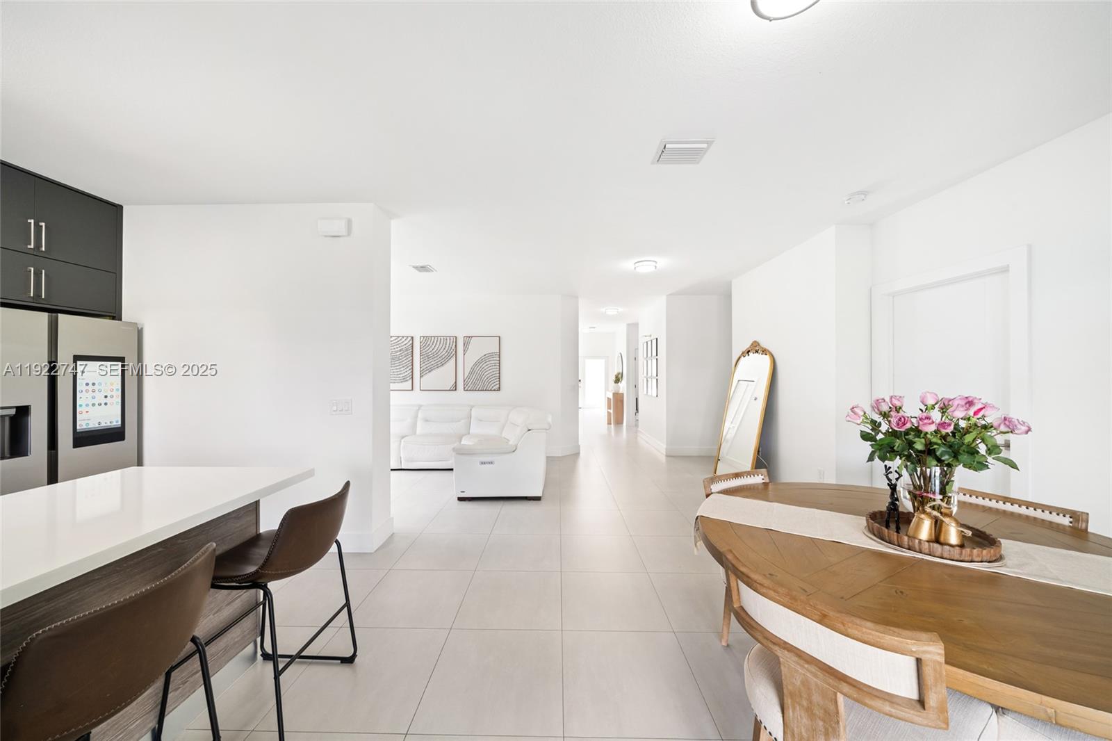 17341 Southwest 304th Street Homestead, FL 33030 - Photo 9 of 25 a dining room with furniture and wooden floor