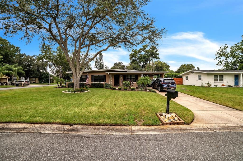 406 Beth Drive Sanford, FL 32771 - Photo 1 of 1 a front view of house with yard and green space