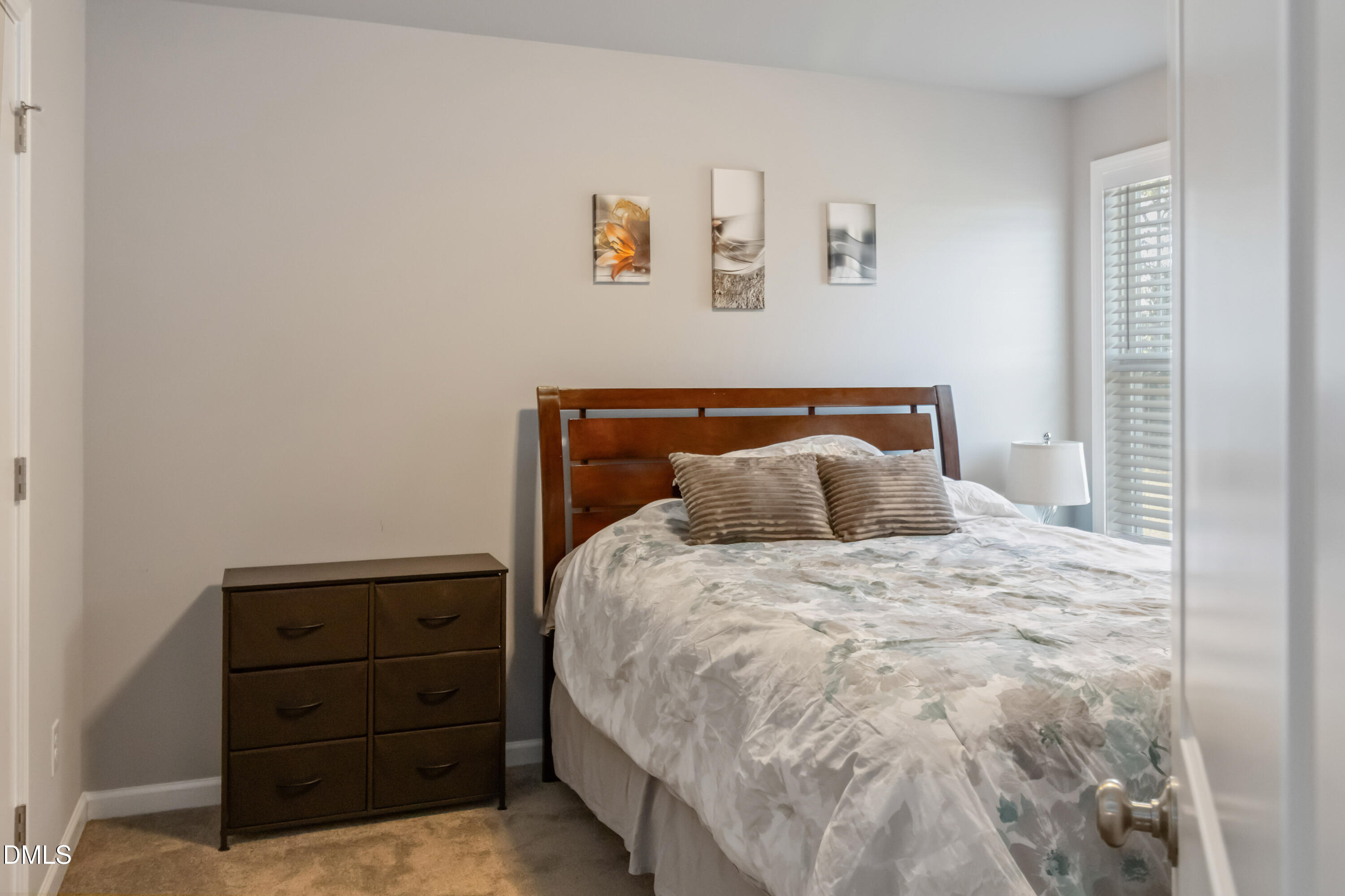 719 New Daniels Chapel Road Fremont, NC 27830 - Photo 18 of 24 a bedroom with a bed and a window