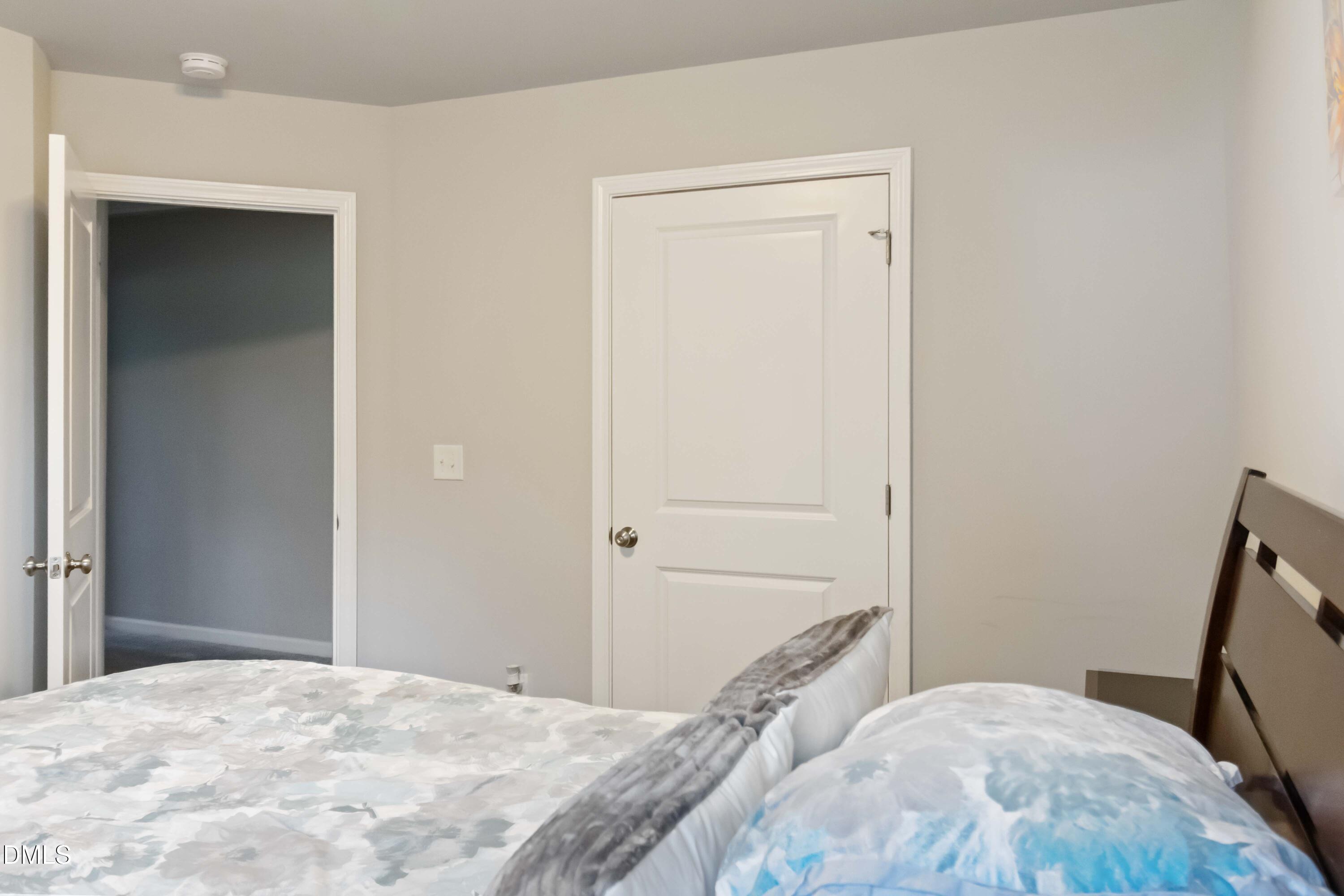 719 New Daniels Chapel Road Fremont, NC 27830 - Photo 19 of 24 a bedroom with a bed and a mirror