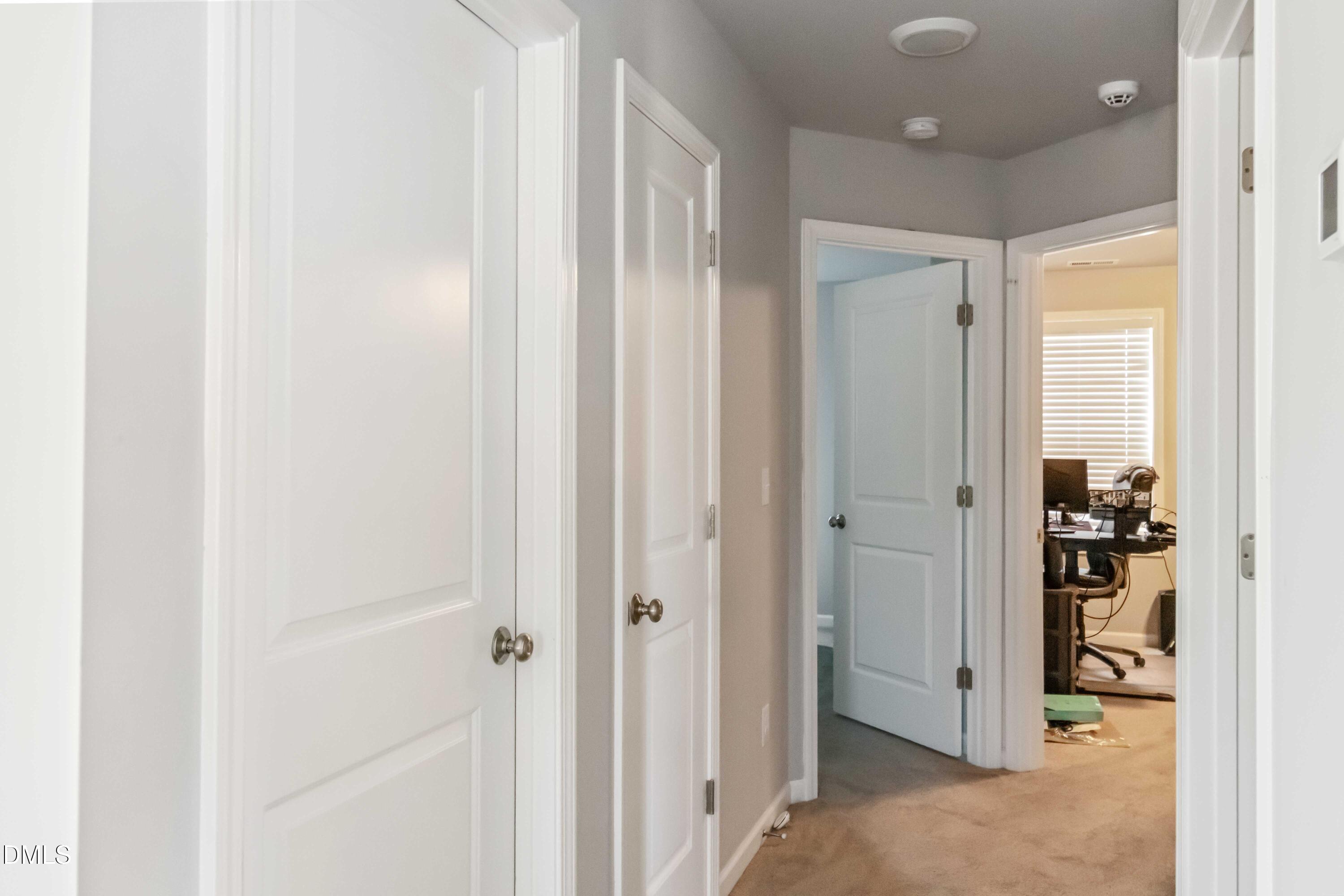 719 New Daniels Chapel Road Fremont, NC 27830 - Photo 22 of 24 a view of a hallway with a closet and a bathroom