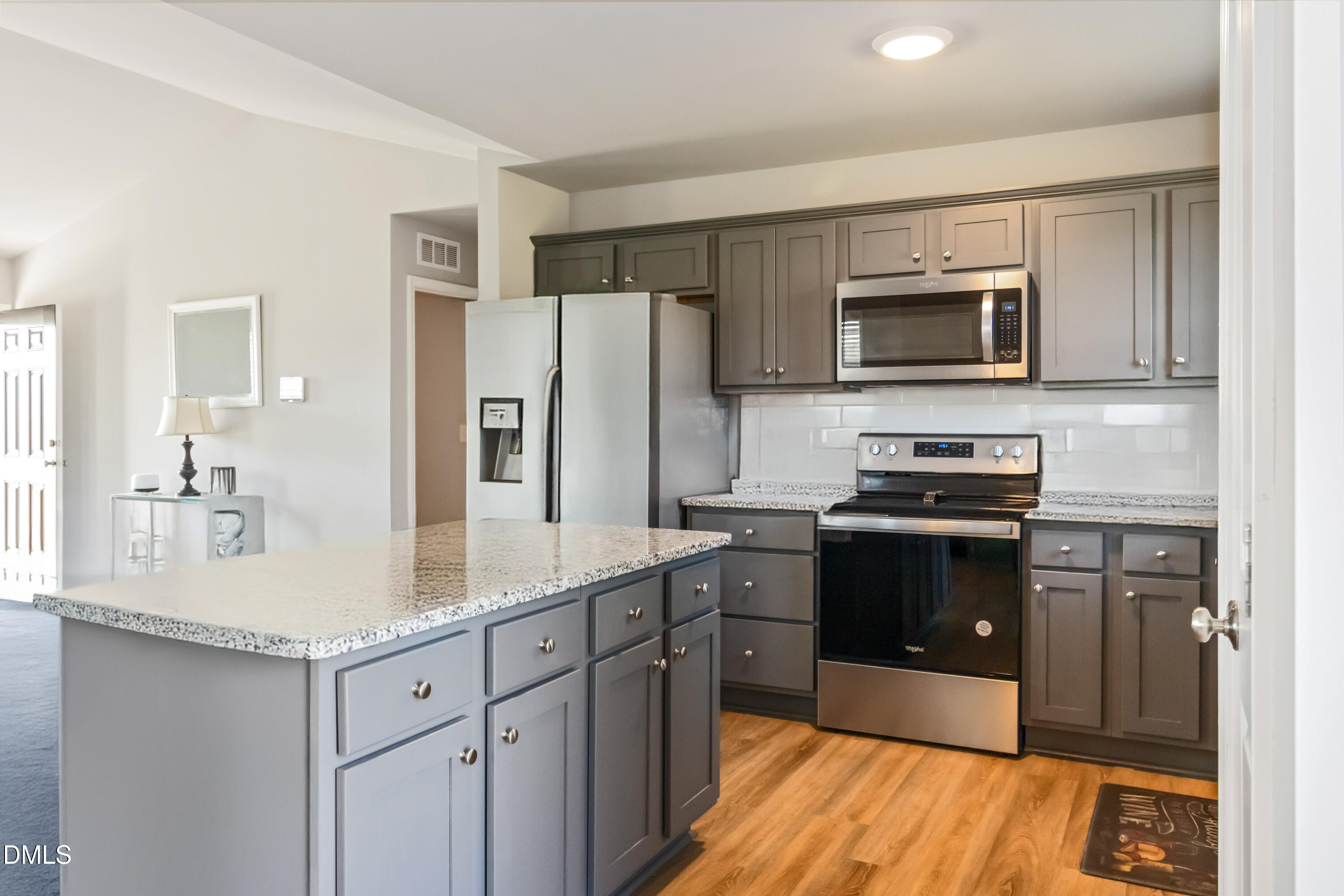 719 New Daniels Chapel Road Fremont, NC 27830 - Photo 4 of 24 a kitchen with stainless steel appliances granite countertop a refrigerator stove microwave and sink
