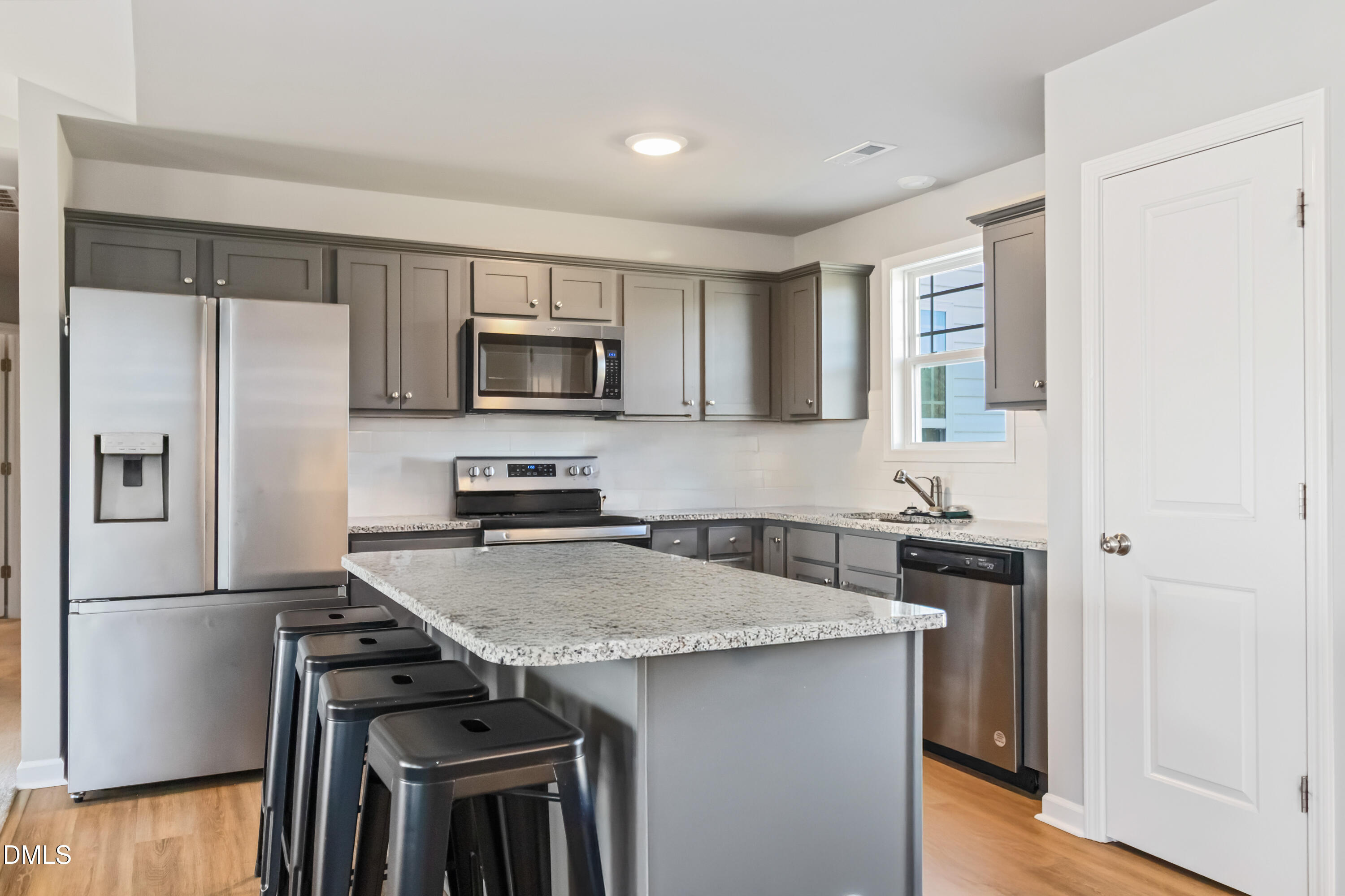 719 New Daniels Chapel Road Fremont, NC 27830 - Photo 5 of 24 a kitchen with stainless steel appliances granite countertop a refrigerator stove microwave and sink