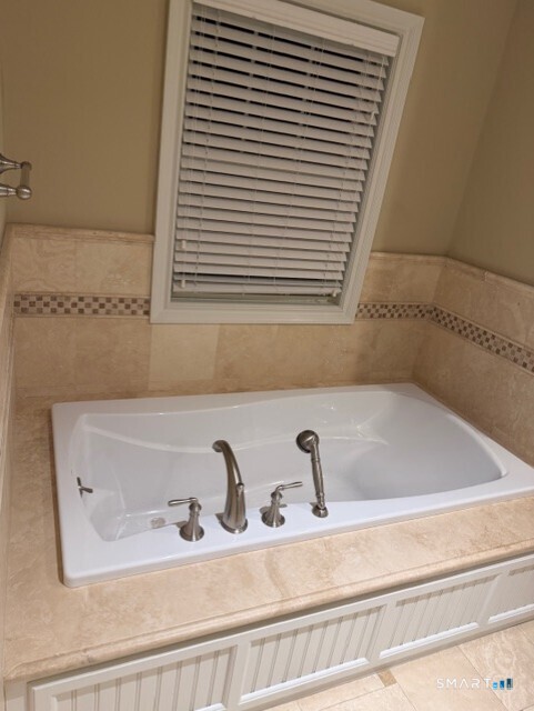 88 Maple Tree Avenue, Unit E Stamford, CT 06906 - Photo 23 of 50 a bathroom with a sink and a bathtub