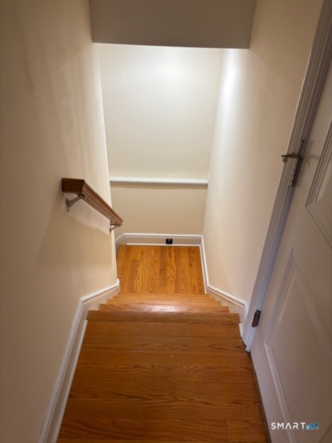 88 Maple Tree Avenue, Unit E Stamford, CT 06906 - Photo 28 of 50 a bedroom with a bed and a window