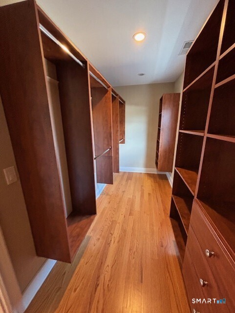 88 Maple Tree Avenue, Unit E Stamford, CT 06906 - Photo 33 of 50 a view of wooden floor in an empty room