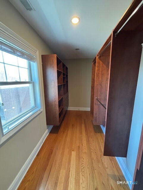 88 Maple Tree Avenue, Unit E Stamford, CT 06906 - Photo 34 of 50 a view of wooden floor in an empty room
