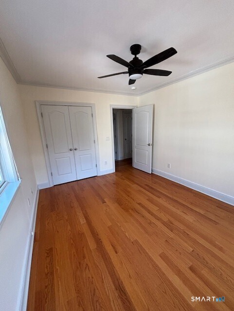 88 Maple Tree Avenue, Unit E Stamford, CT 06906 - Photo 35 of 50 a view of empty room with wooden floor
