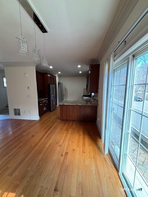 88 Maple Tree Avenue, Unit E Stamford, CT 06906 - Photo 41 of 50 a view of hallway with wooden floor
