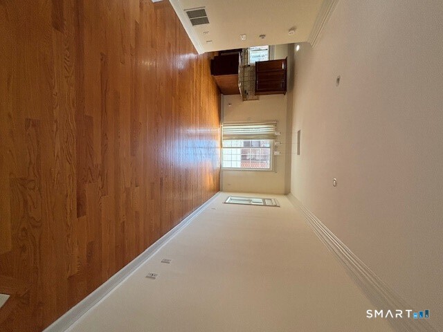88 Maple Tree Avenue, Unit E Stamford, CT 06906 - Photo 43 of 50 a view of a house with a hallway