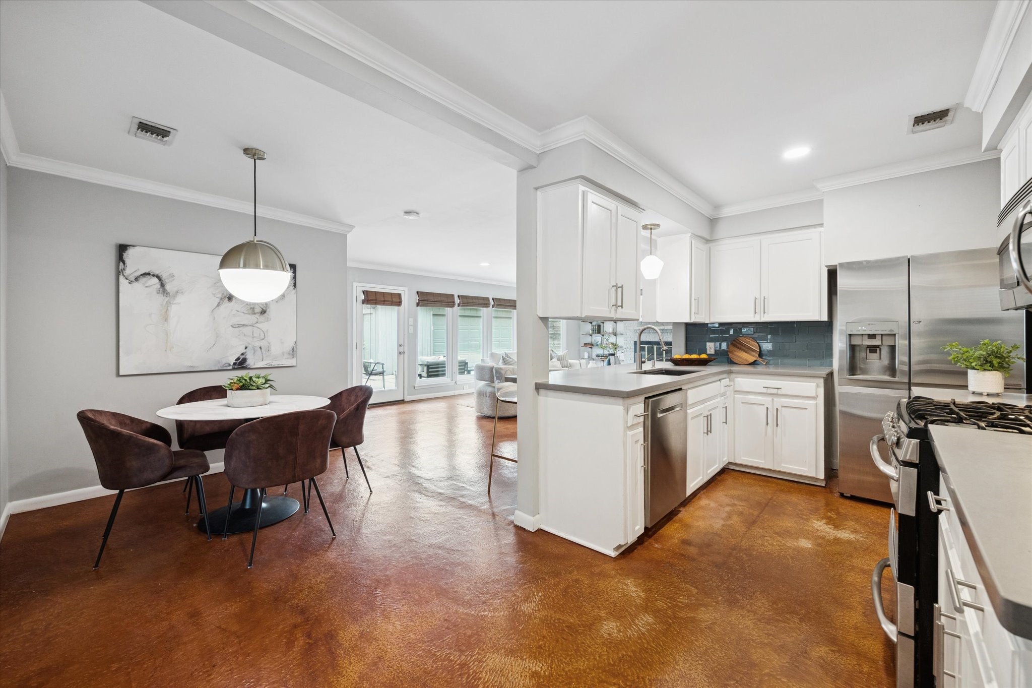 5234 Libbey Drive Houston, TX 77092 - Photo 20 of 35 The kitchen features stainless appliances, a convection oven, gas range and a stylish glass subway tile backsplash.