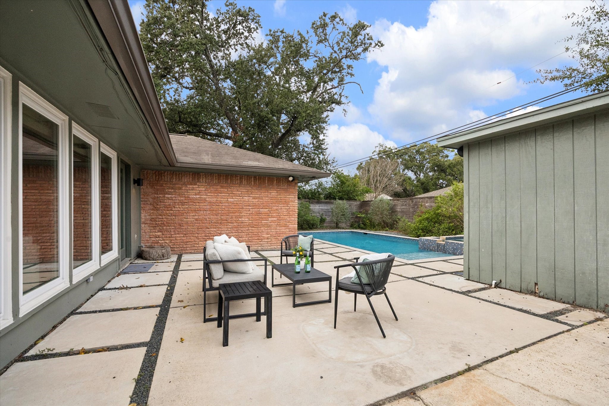 5234 Libbey Drive Houston, TX 77092 - Photo 27 of 35 With its low maintenance hardscaping, this backyard is made for effortless relaxation.