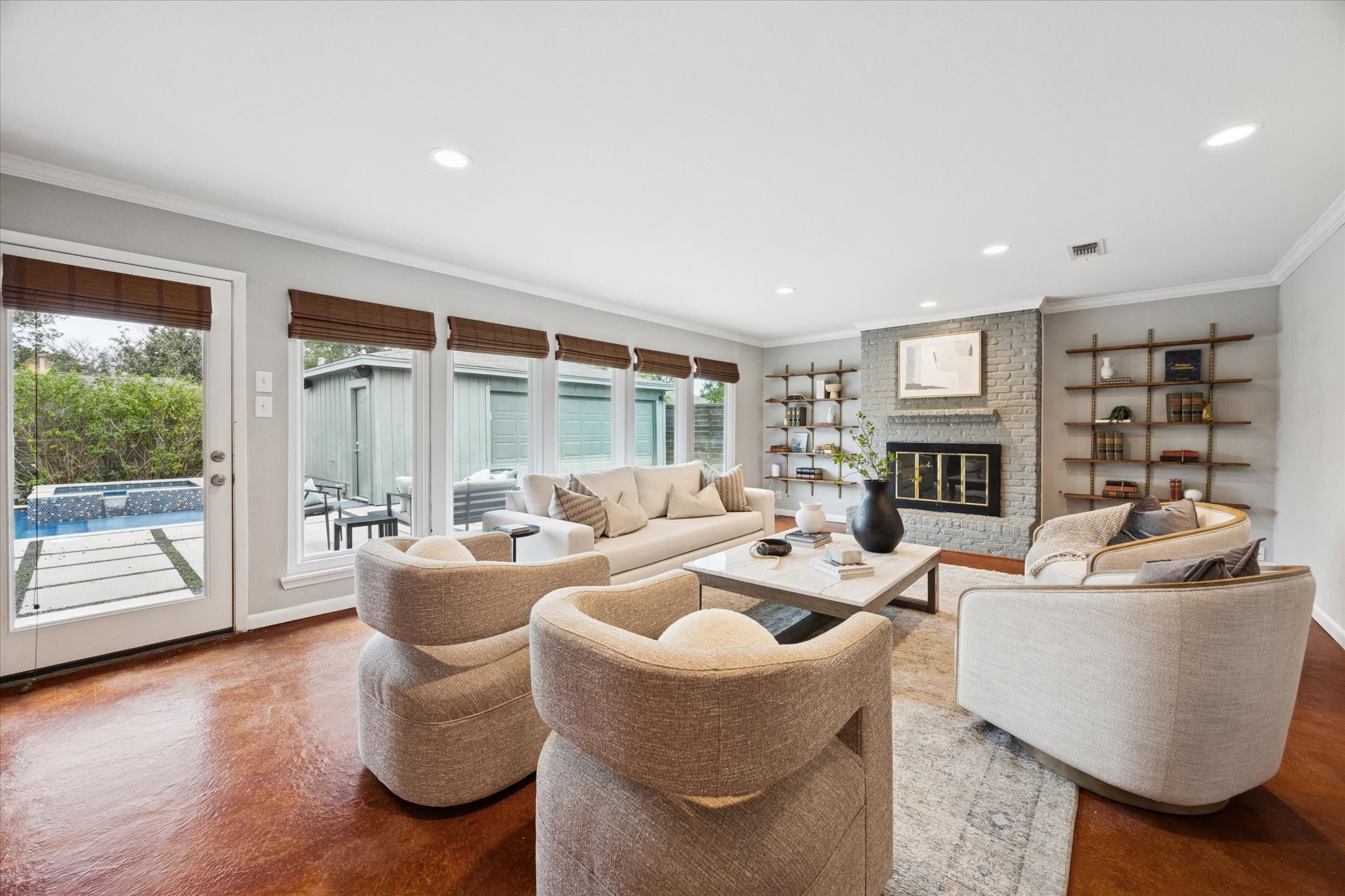 5234 Libbey Drive Houston, TX 77092 - Photo 5 of 35 Natural light floods the room through a wall of windows with custom woven wood blinds overlooking the pool.