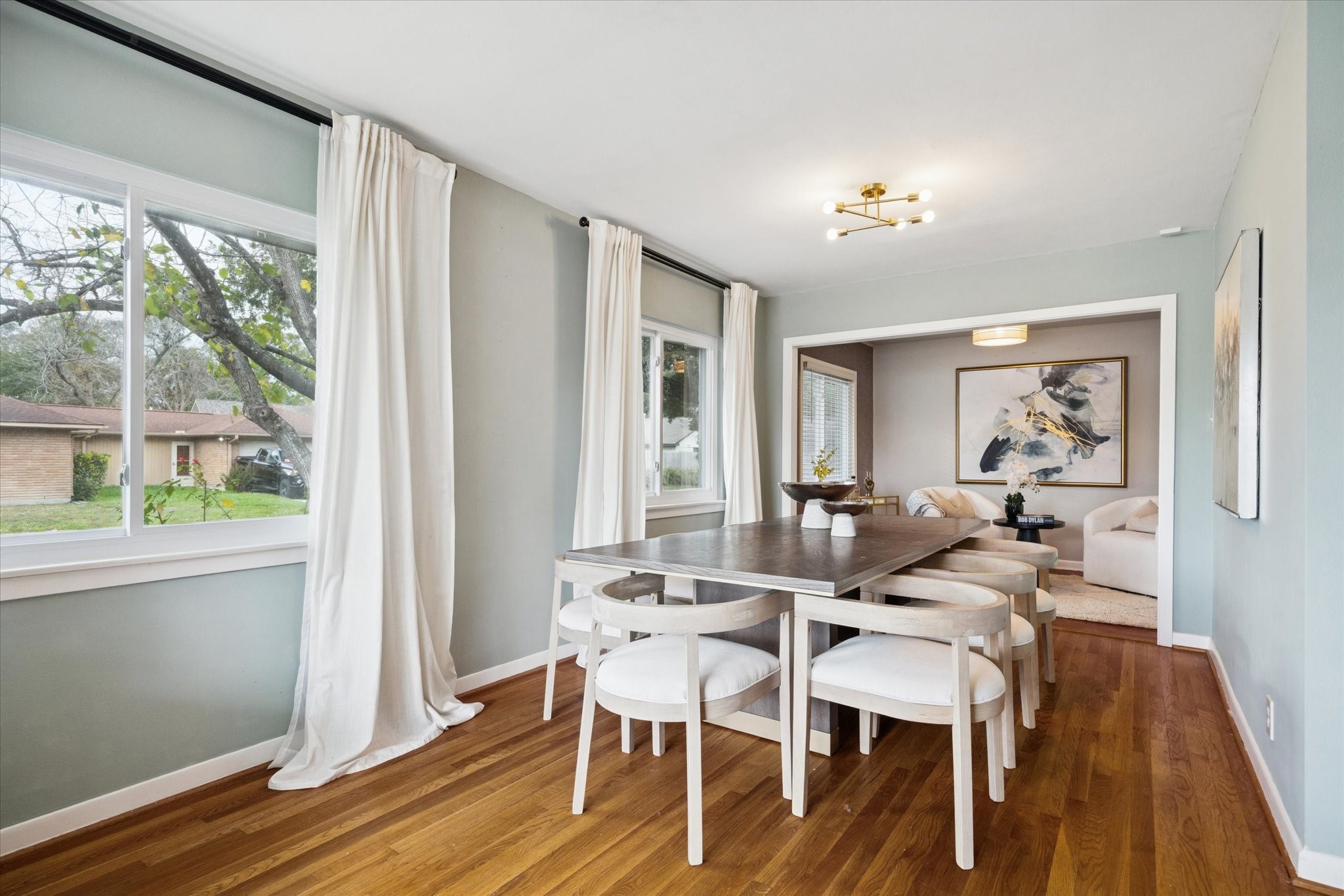 5234 Libbey Drive Houston, TX 77092 - Photo 7 of 35 The spacious dining room features hardwood floors and large windows that fill the space with natural light.