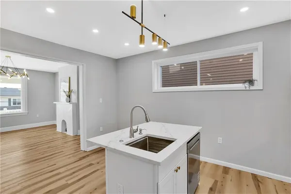 a kitchen with a sink and cabinets