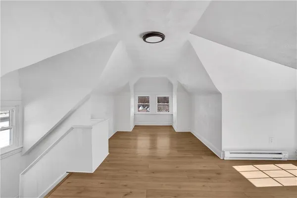a view of a livingroom with wooden floor