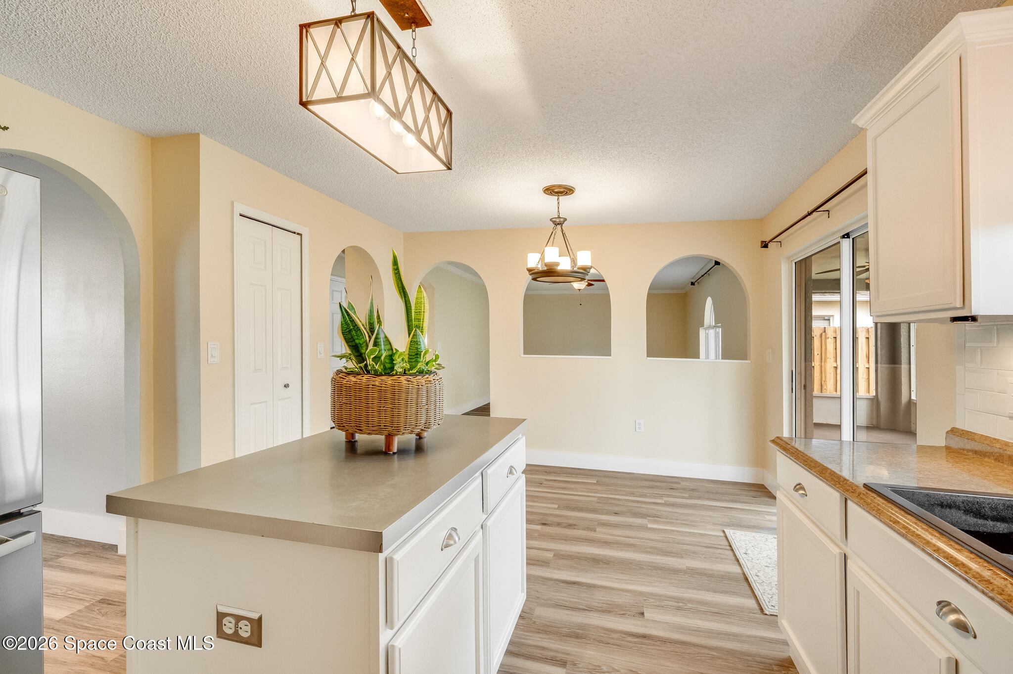 2250 Spring Creek Circle Palm Bay, FL 32905 - Photo 13 of 84 a view of living room kitchen and entryway