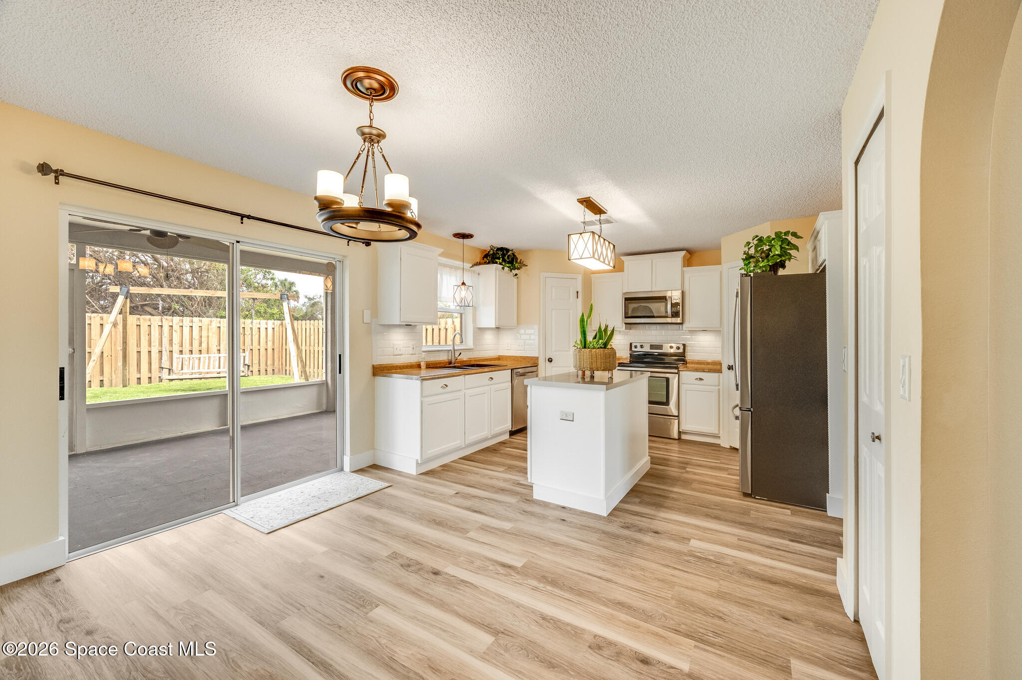 2250 Spring Creek Circle Palm Bay, FL 32905 - Photo 18 of 84 a view of a kitchen with wooden floor