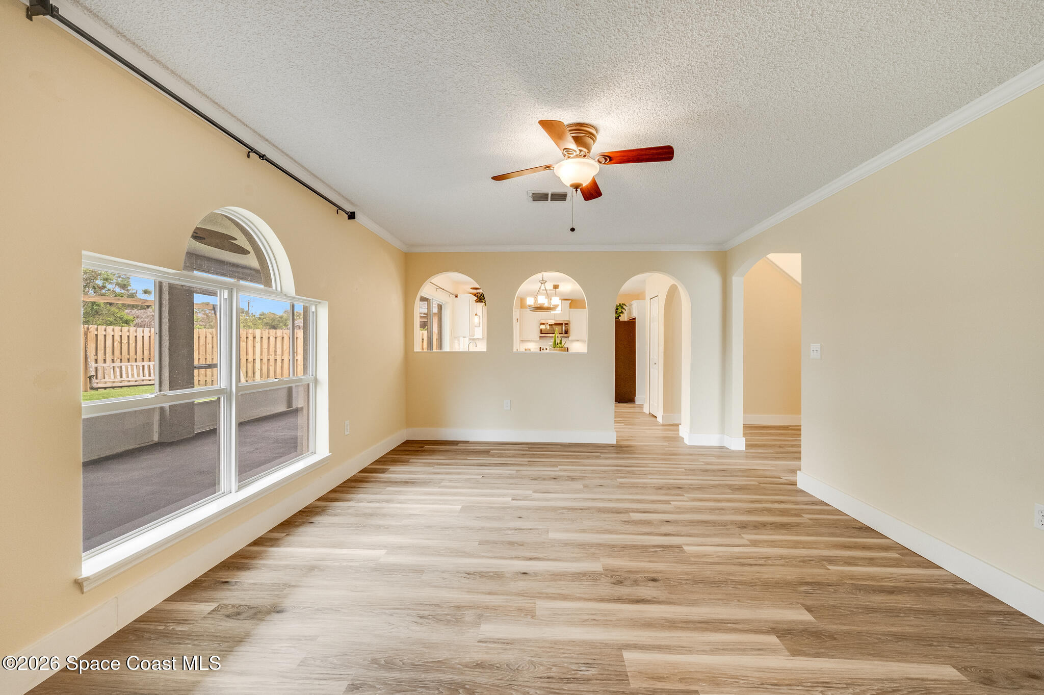 2250 Spring Creek Circle Palm Bay, FL 32905 - Photo 20 of 84 a view of an entryway with wooden floor and a fireplace