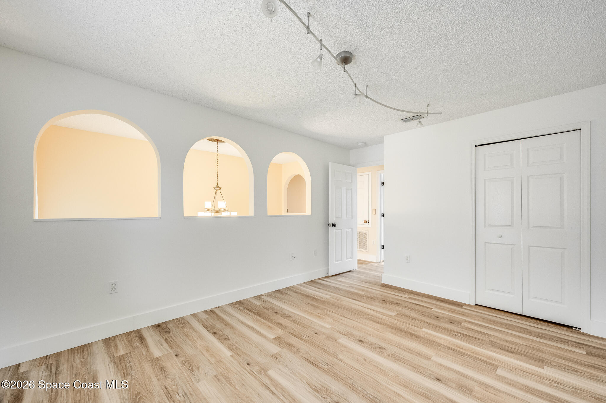 2250 Spring Creek Circle Palm Bay, FL 32905 - Photo 27 of 84 a view of empty room with wooden floor