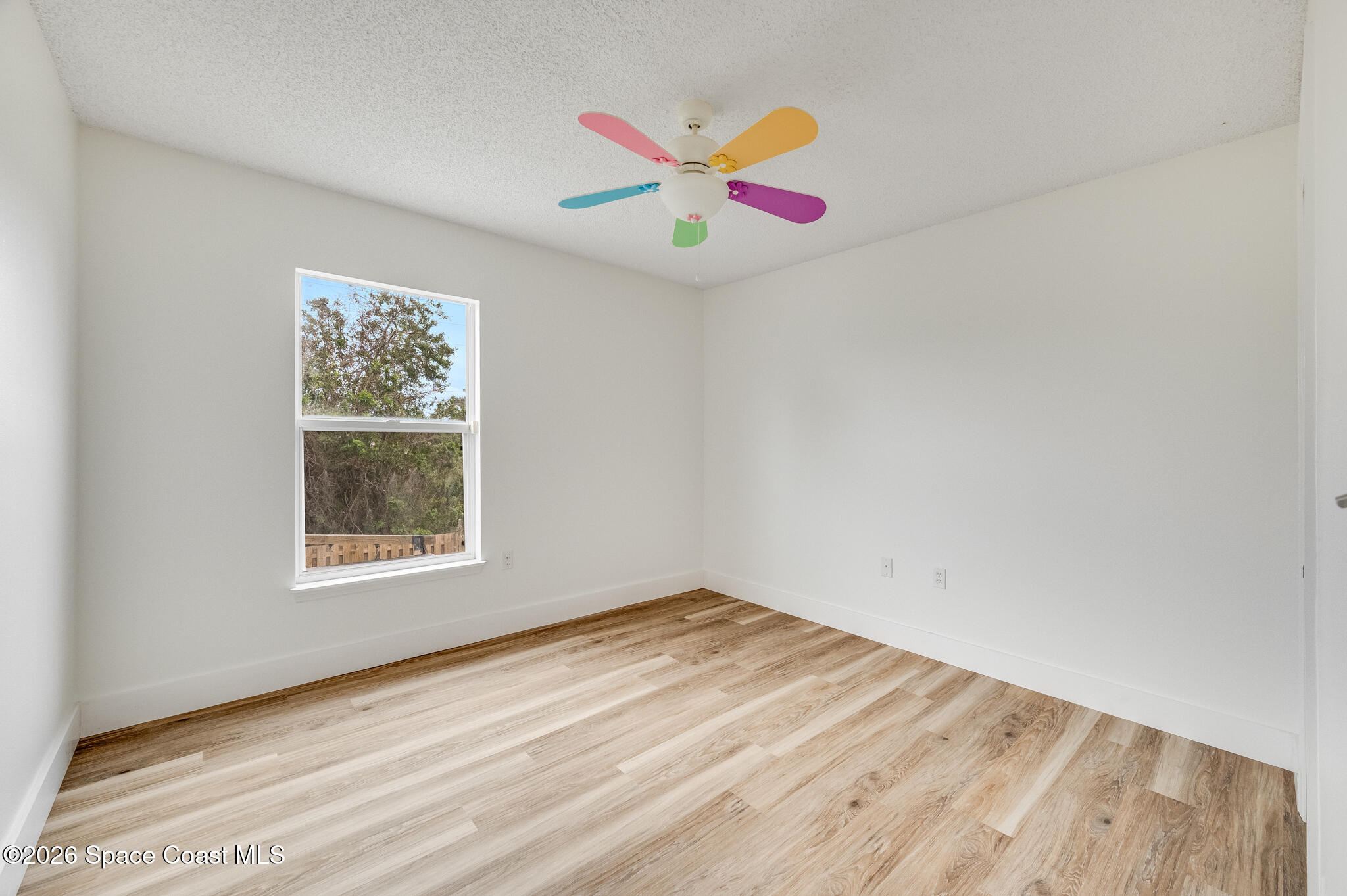 2250 Spring Creek Circle Palm Bay, FL 32905 - Photo 30 of 84 an empty room with a window