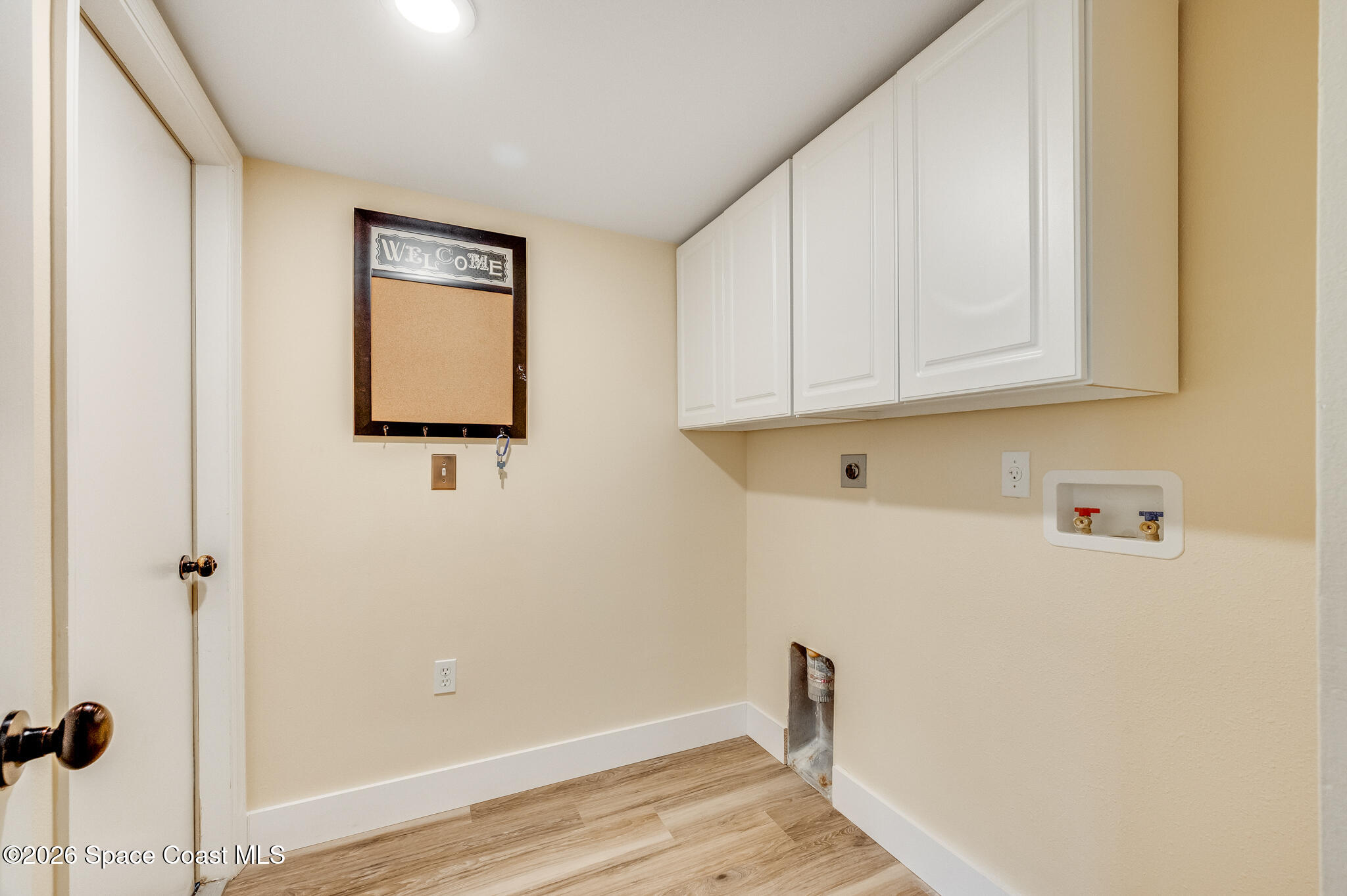 2250 Spring Creek Circle Palm Bay, FL 32905 - Photo 33 of 84 a view of storage and utility room with wooden floor