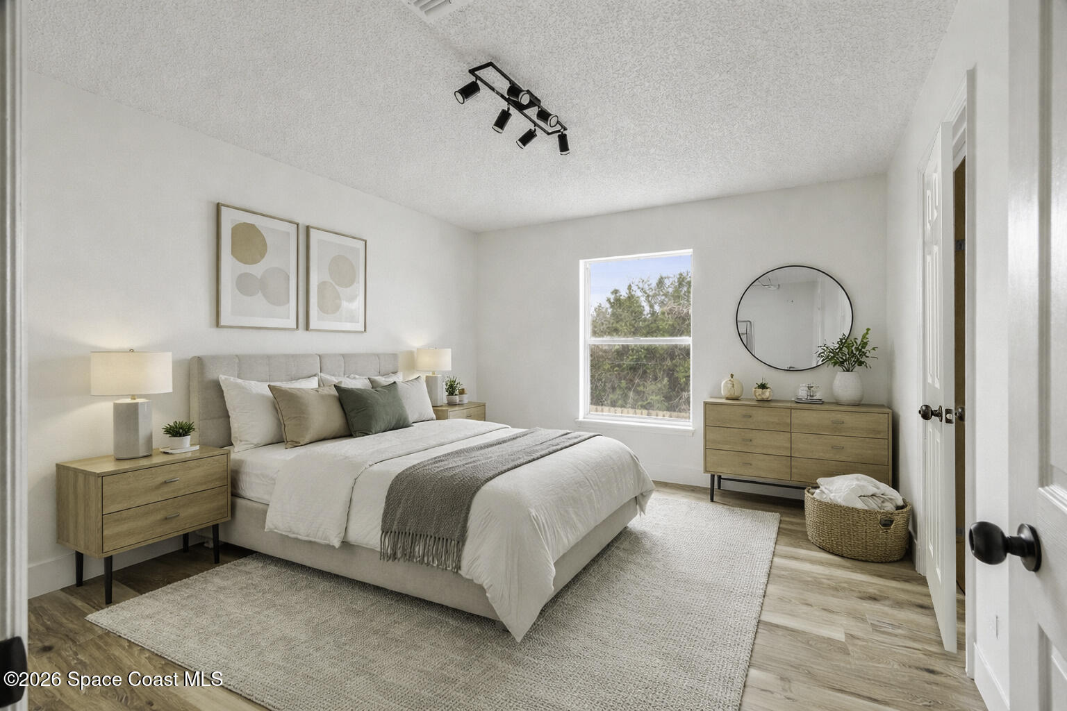 2250 Spring Creek Circle Palm Bay, FL 32905 - Photo 36 of 84 a bedroom with a bed mirror and window