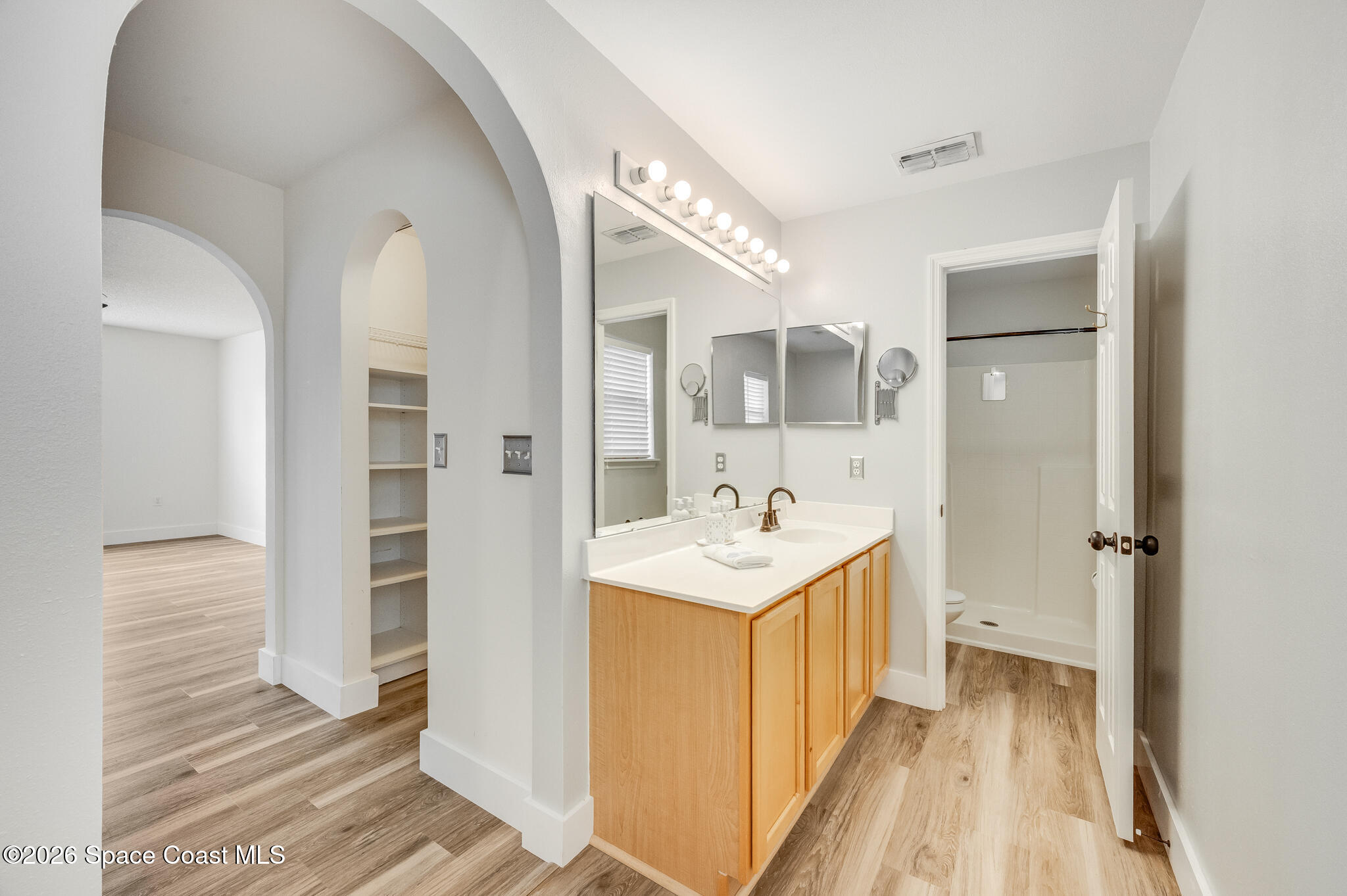 2250 Spring Creek Circle Palm Bay, FL 32905 - Photo 41 of 84 a view of a bathroom with a sink and mirror