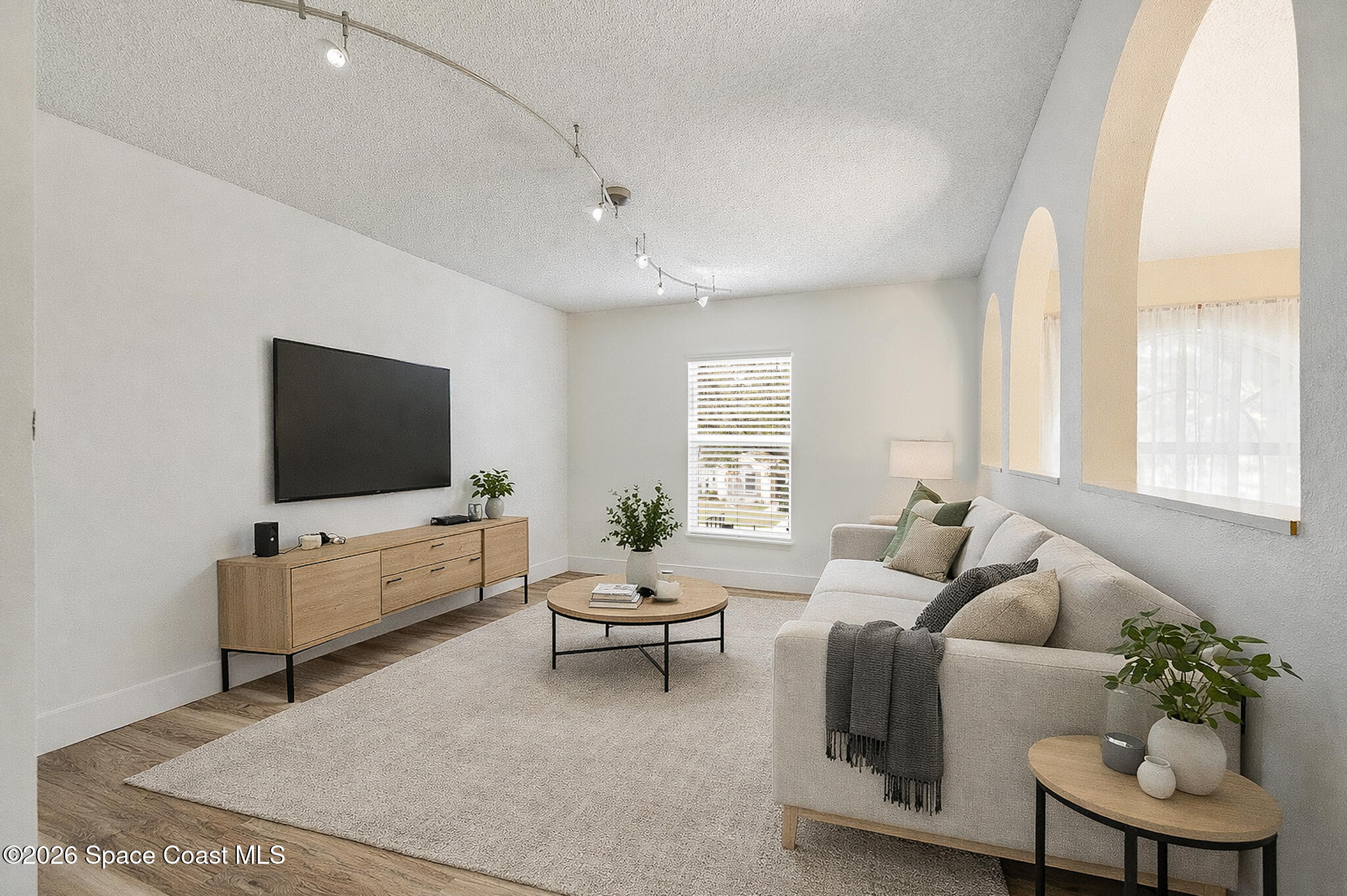 2250 Spring Creek Circle Palm Bay, FL 32905 - Photo 47 of 84 a living room with furniture and a flat screen tv