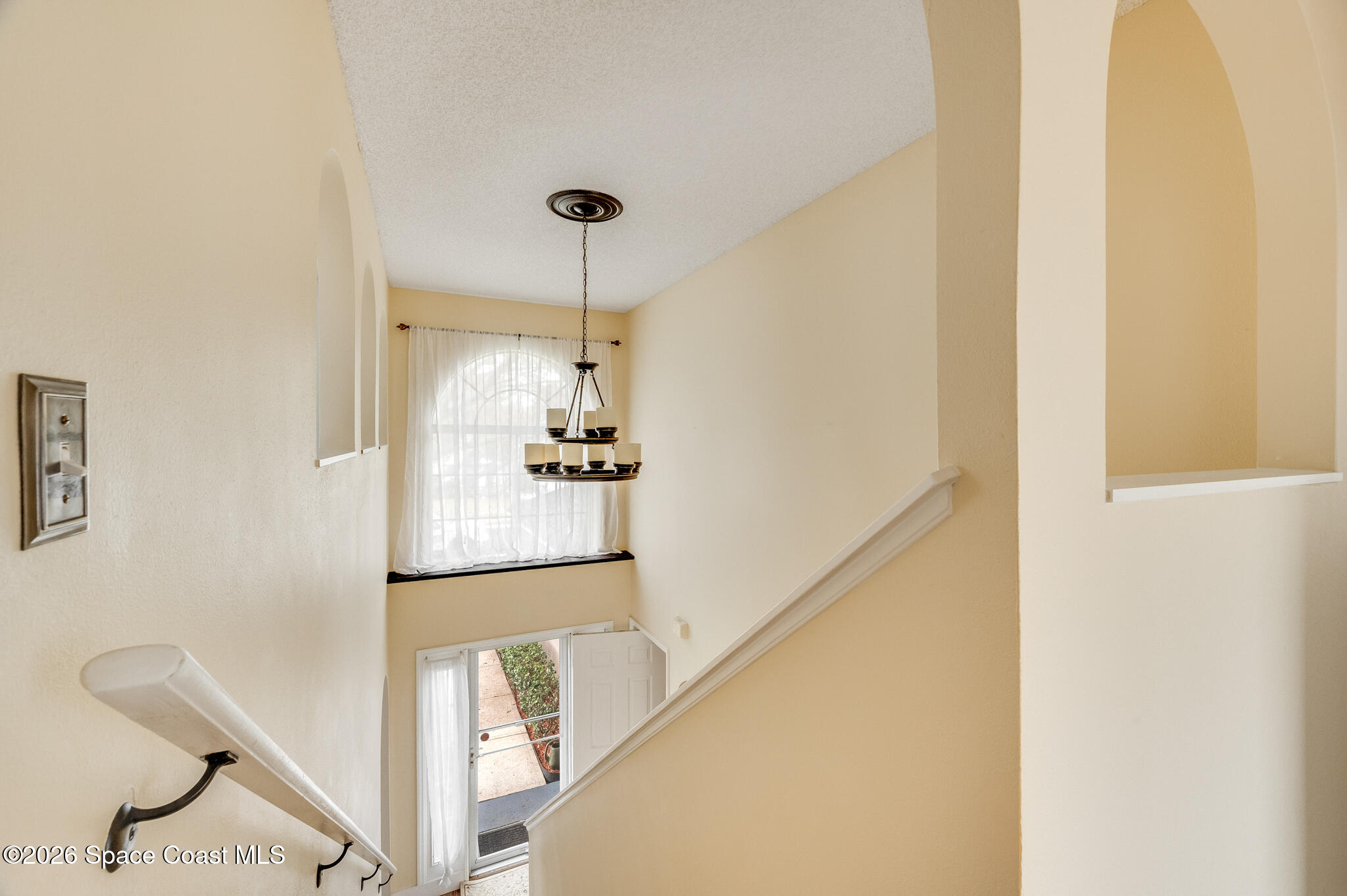 2250 Spring Creek Circle Palm Bay, FL 32905 - Photo 50 of 84 a view of a hallway with furniture and entryway