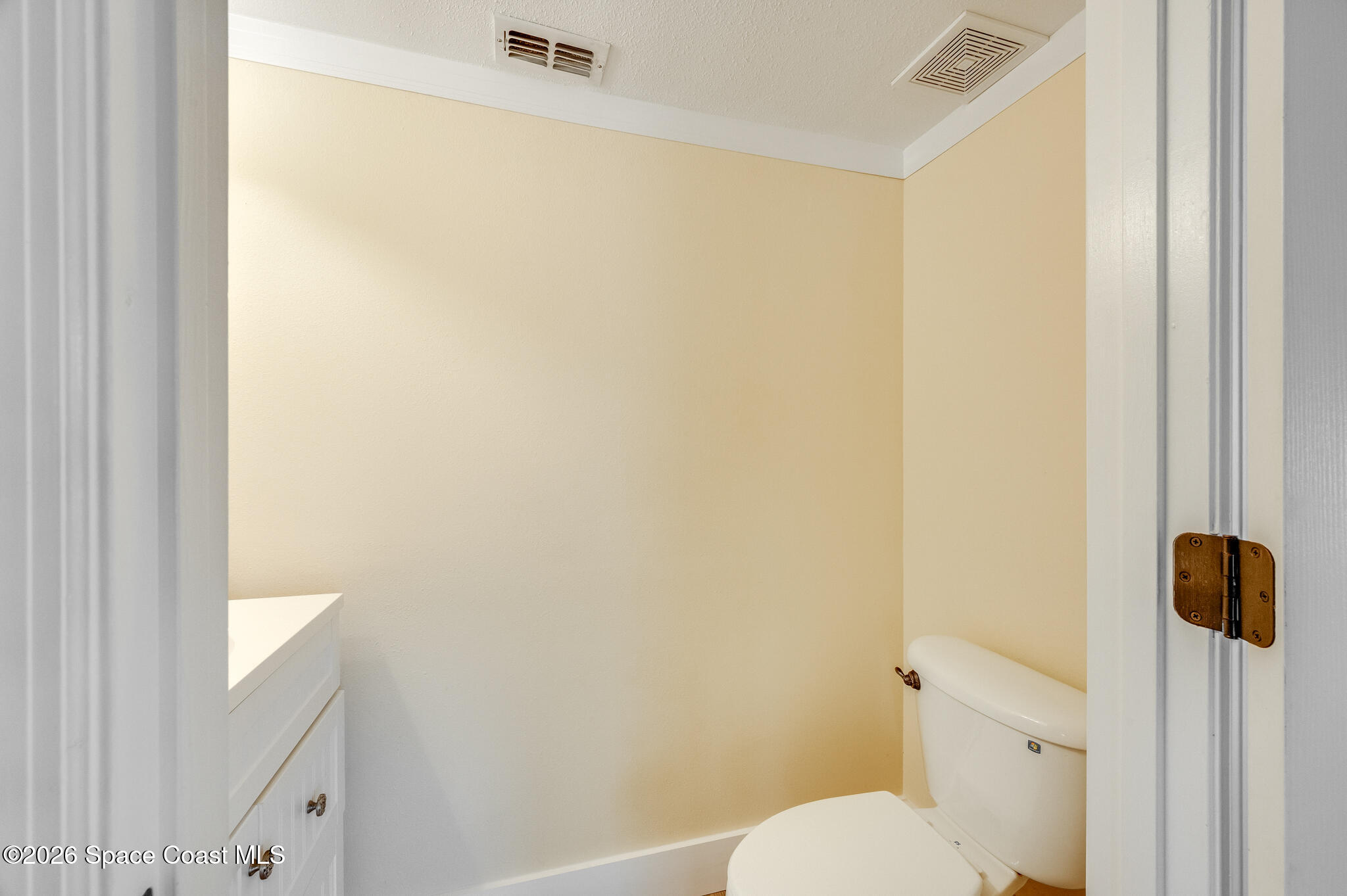 2250 Spring Creek Circle Palm Bay, FL 32905 - Photo 54 of 84 a white toilet sitting next to a shower