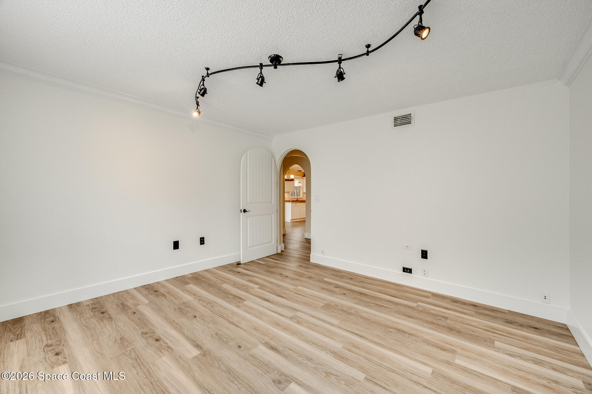 2250 Spring Creek Circle Palm Bay, FL 32905 - Photo 56 of 84 a view of a room with rack and wooden floor