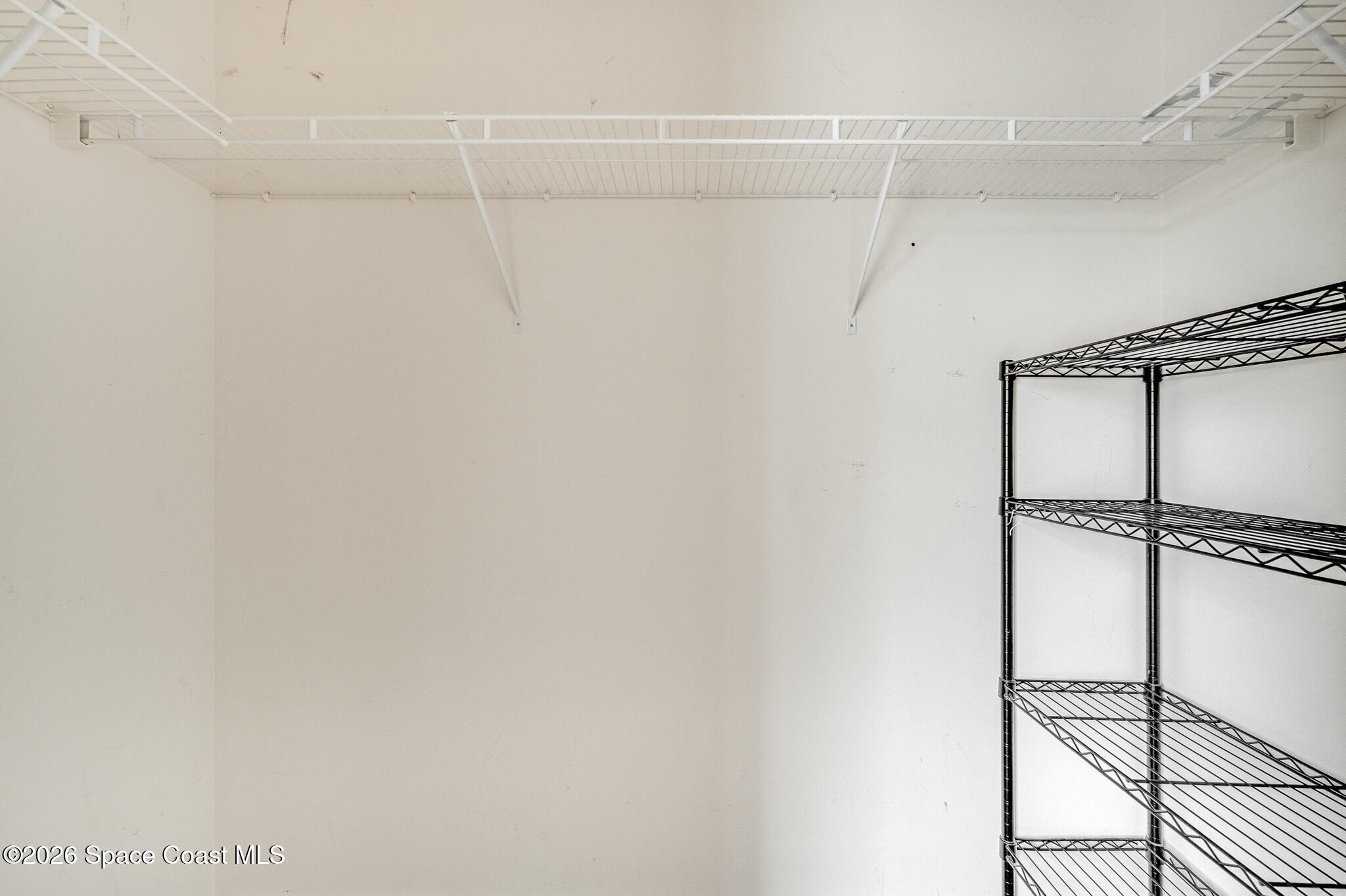 2250 Spring Creek Circle Palm Bay, FL 32905 - Photo 64 of 84 a view of a room with racks on the wall