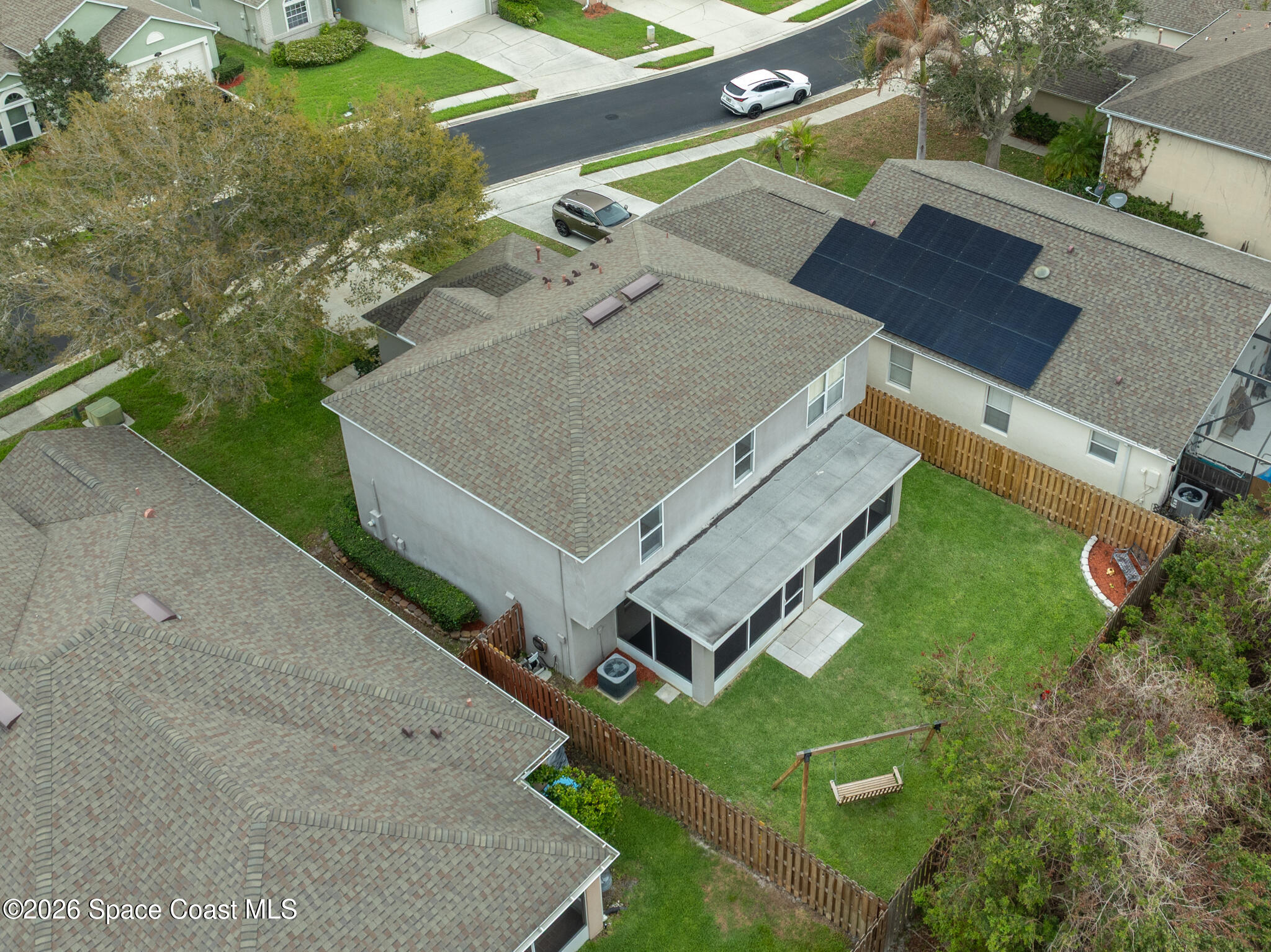2250 Spring Creek Circle Palm Bay, FL 32905 - Photo 77 of 84 an aerial view of a house with a yard