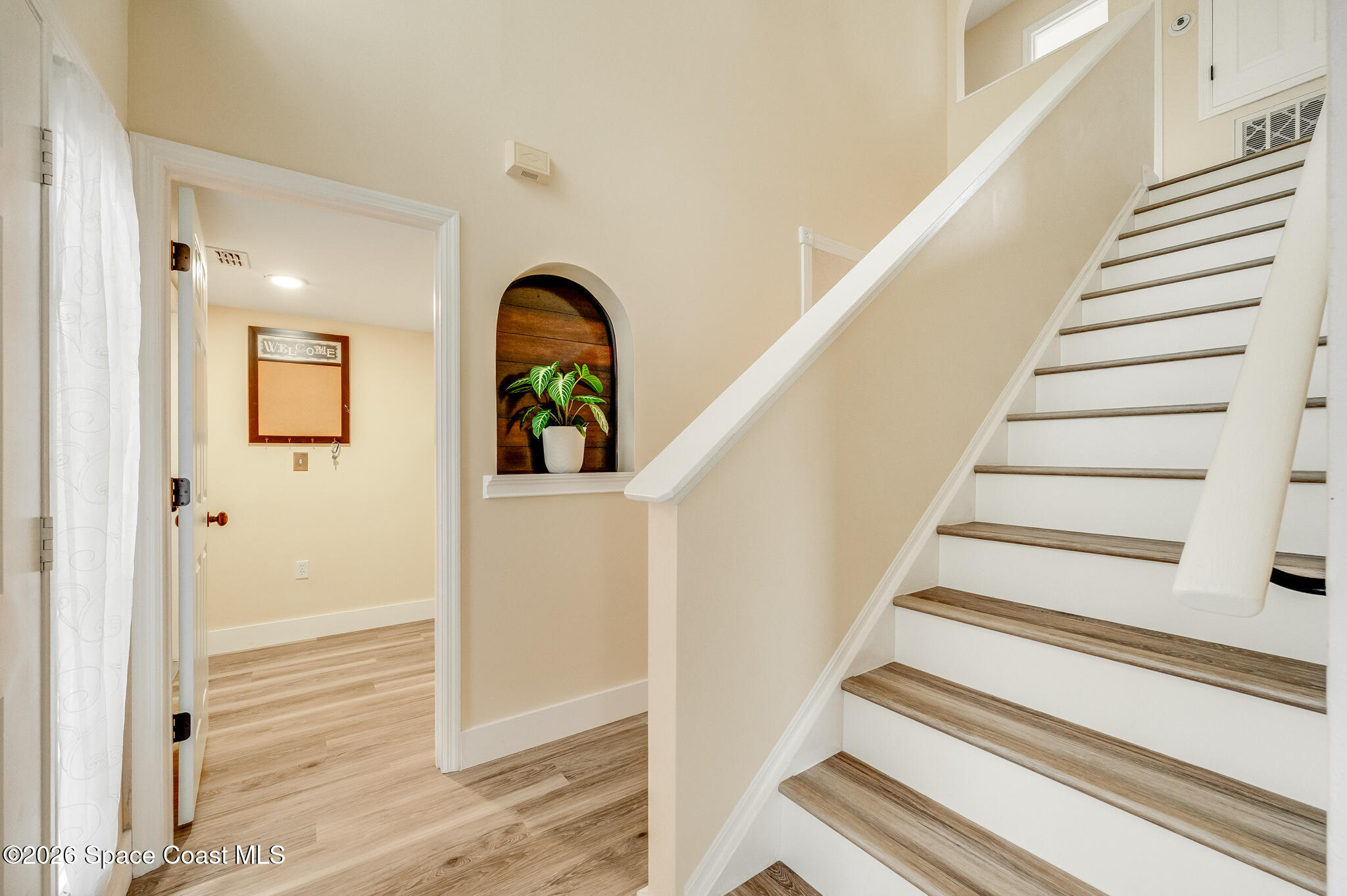 2250 Spring Creek Circle Palm Bay, FL 32905 - Photo 9 of 84 a view of entryway and hall with wooden floor