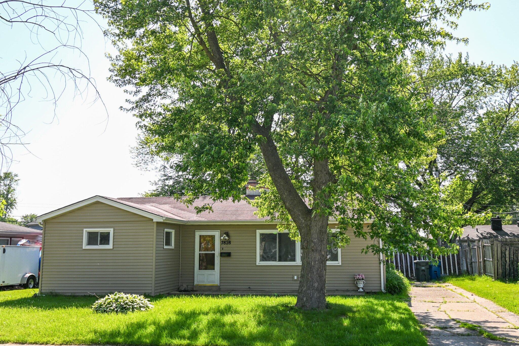 7828 Chestnut Avenue Hammond, IN 46324 - Photo 22 of 23 a front view of a house with garden