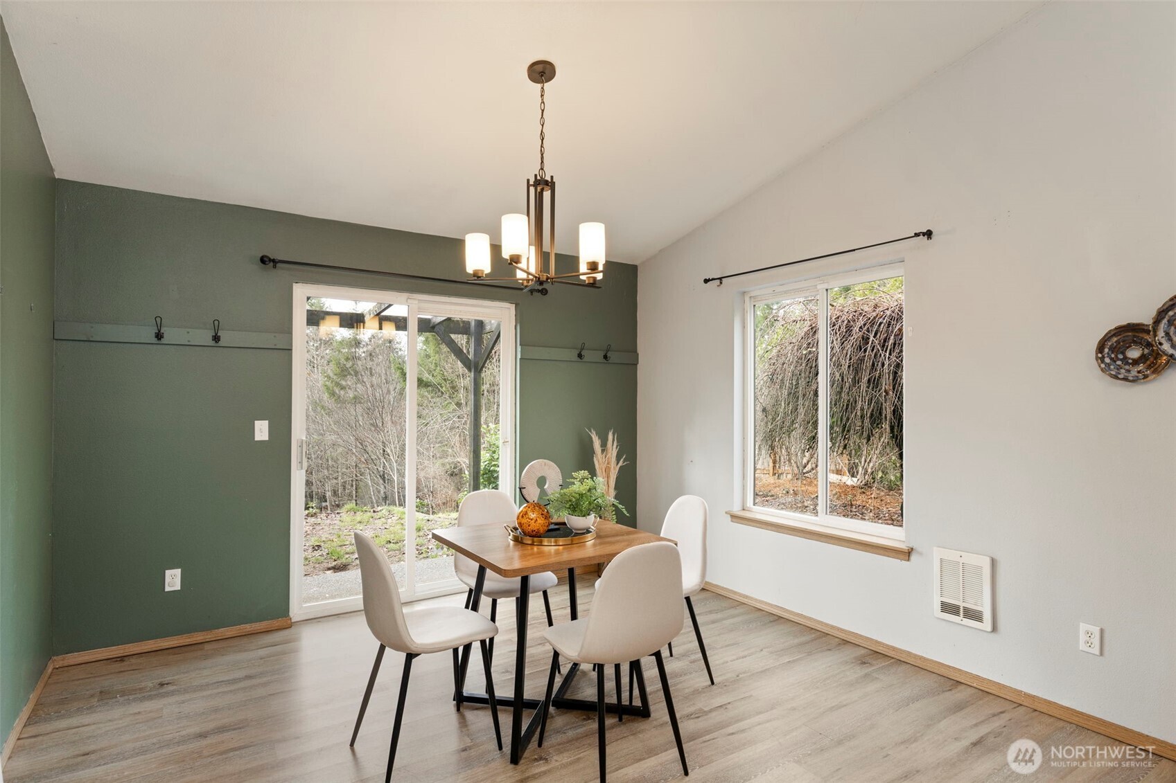 421 Northeast Cutlass Way Belfair, WA 98528 - Photo 12 of 35 a view of a dining room with furniture window and outside view