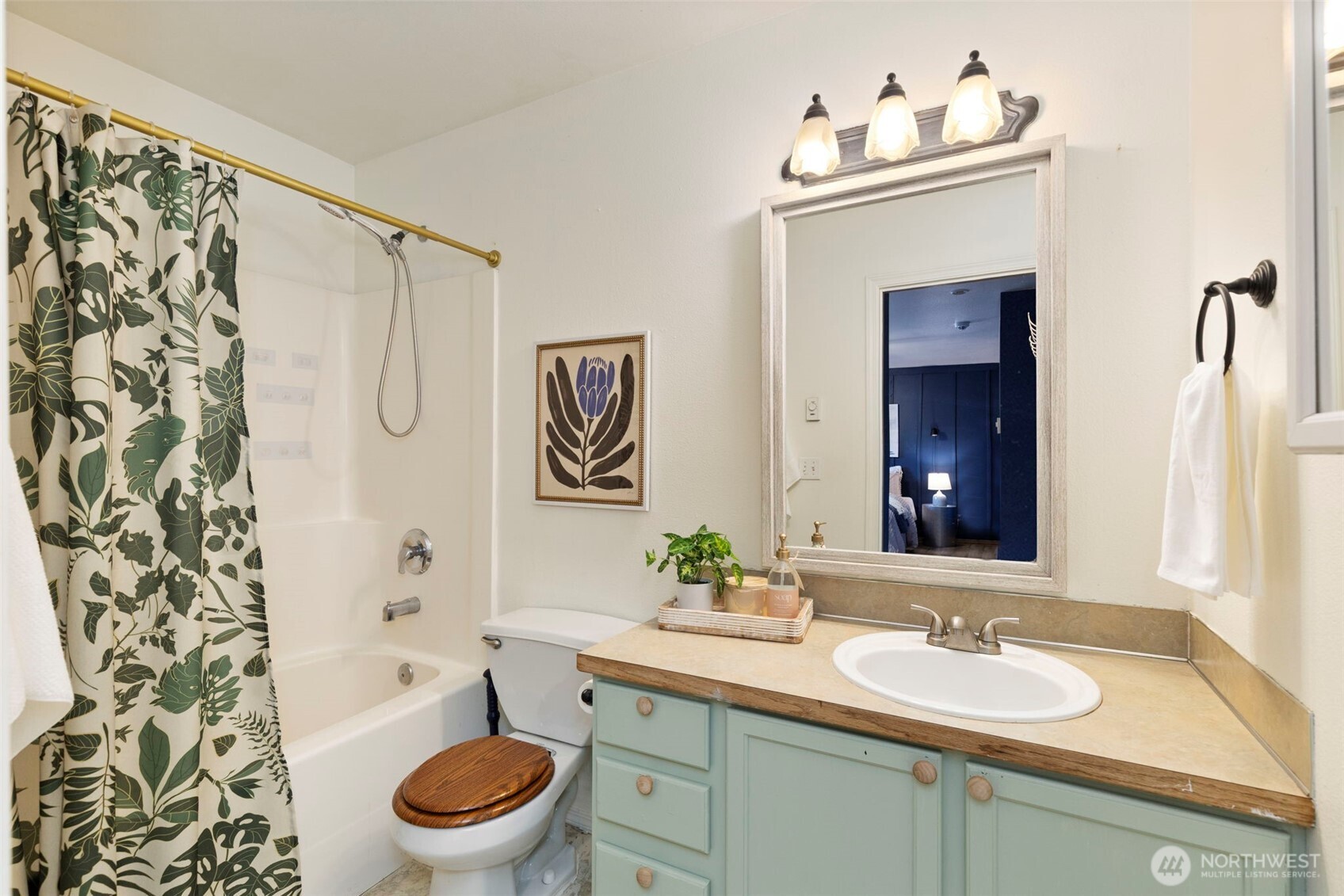 421 Northeast Cutlass Way Belfair, WA 98528 - Photo 17 of 35 a bathroom with a sink toilet and shower