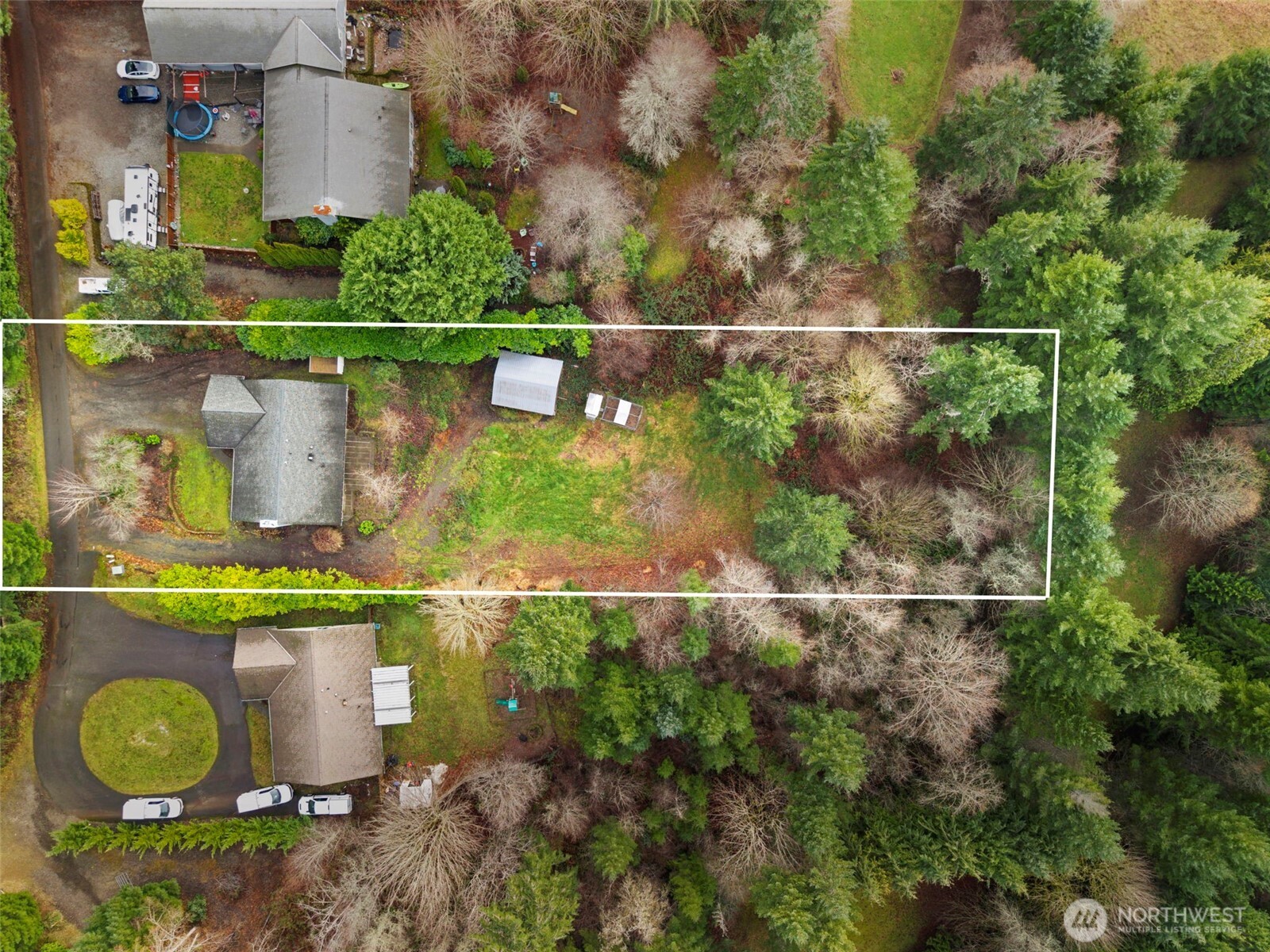 421 Northeast Cutlass Way Belfair, WA 98528 - Photo 2 of 35 an aerial view of a house with a yard and a fountain