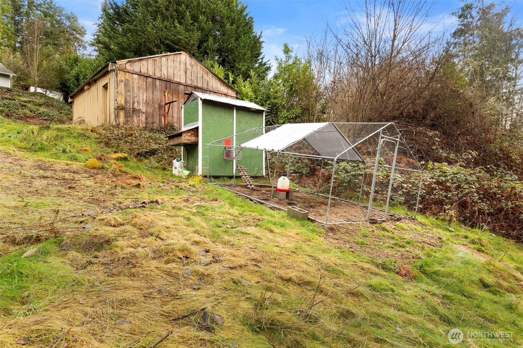 421 Northeast Cutlass Way Belfair, WA 98528 - Photo 30 of 35 a view of a house with a yard