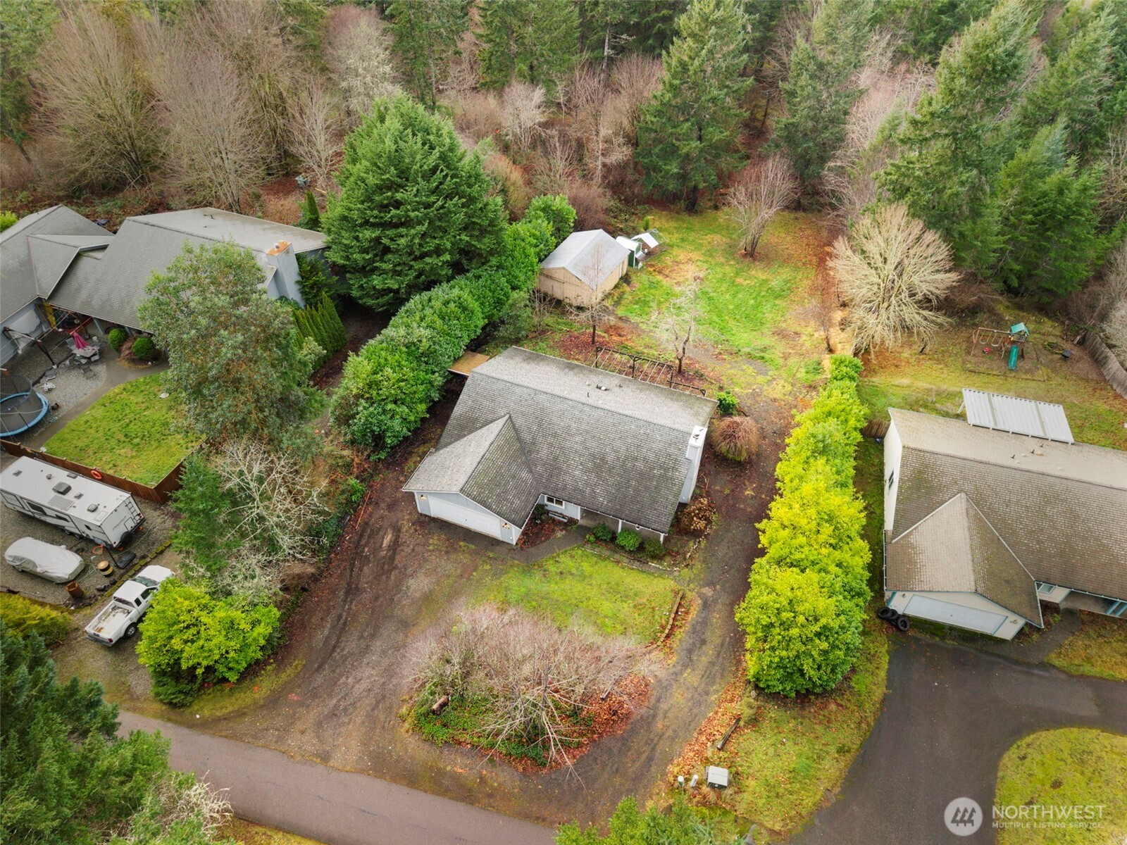 421 Northeast Cutlass Way Belfair, WA 98528 - Photo 3 of 35 an aerial view of a house with a yard basket ball court