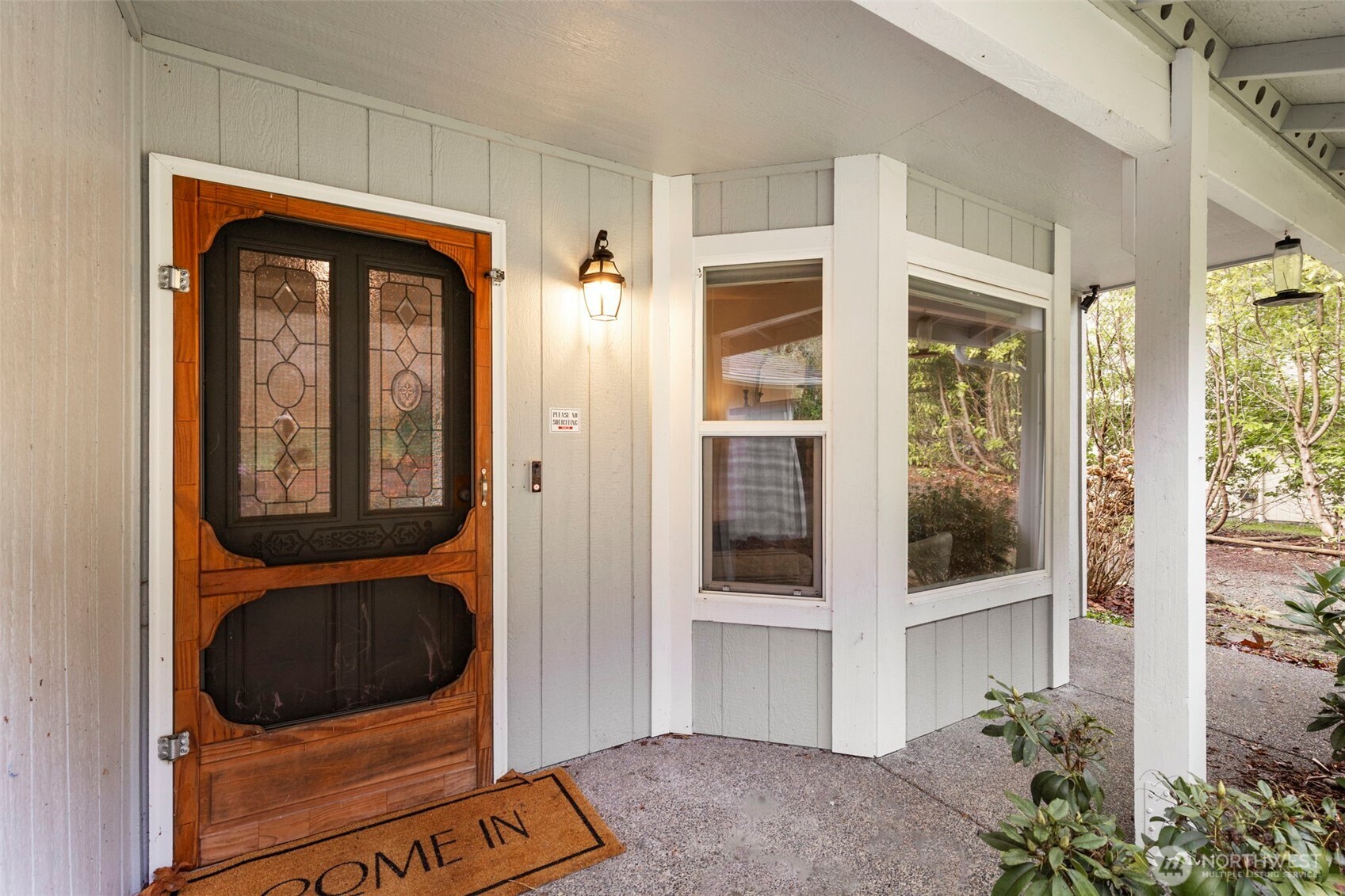 421 Northeast Cutlass Way Belfair, WA 98528 - Photo 5 of 35 a view of front door of house