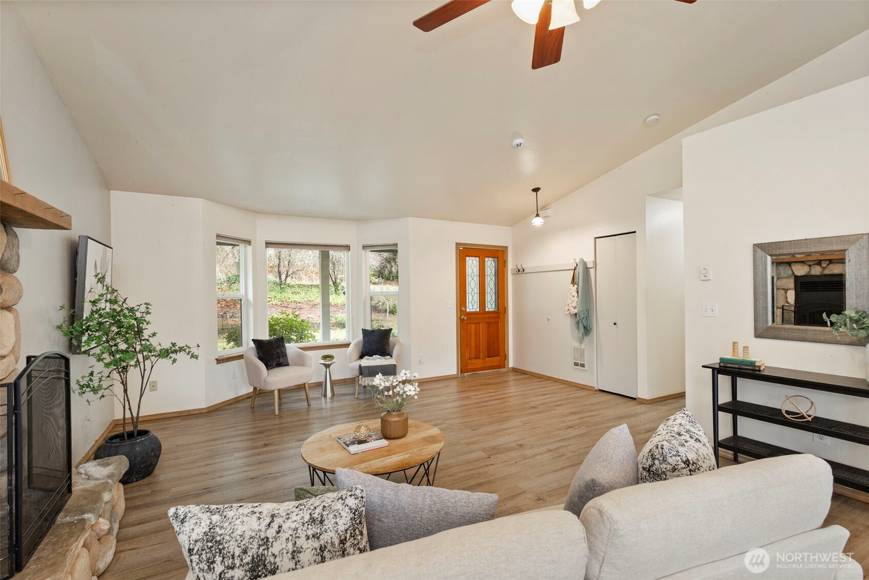 421 Northeast Cutlass Way Belfair, WA 98528 - Photo 8 of 35 a living room with furniture and a large window