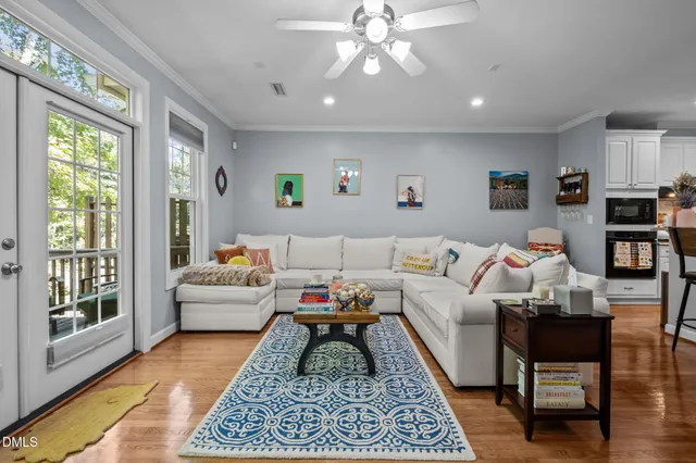 a living room with furniture and a rug