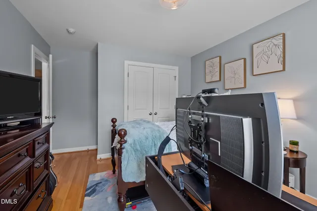 a room with furniture and a flat screen tv