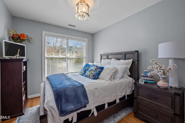 a bedroom with bed and a window