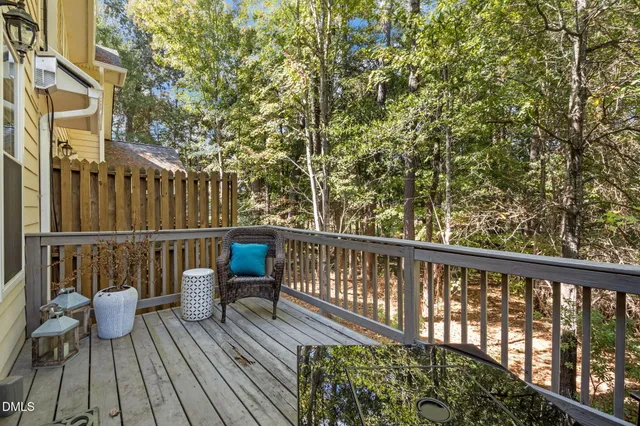 a view of a balcony with wooden floor